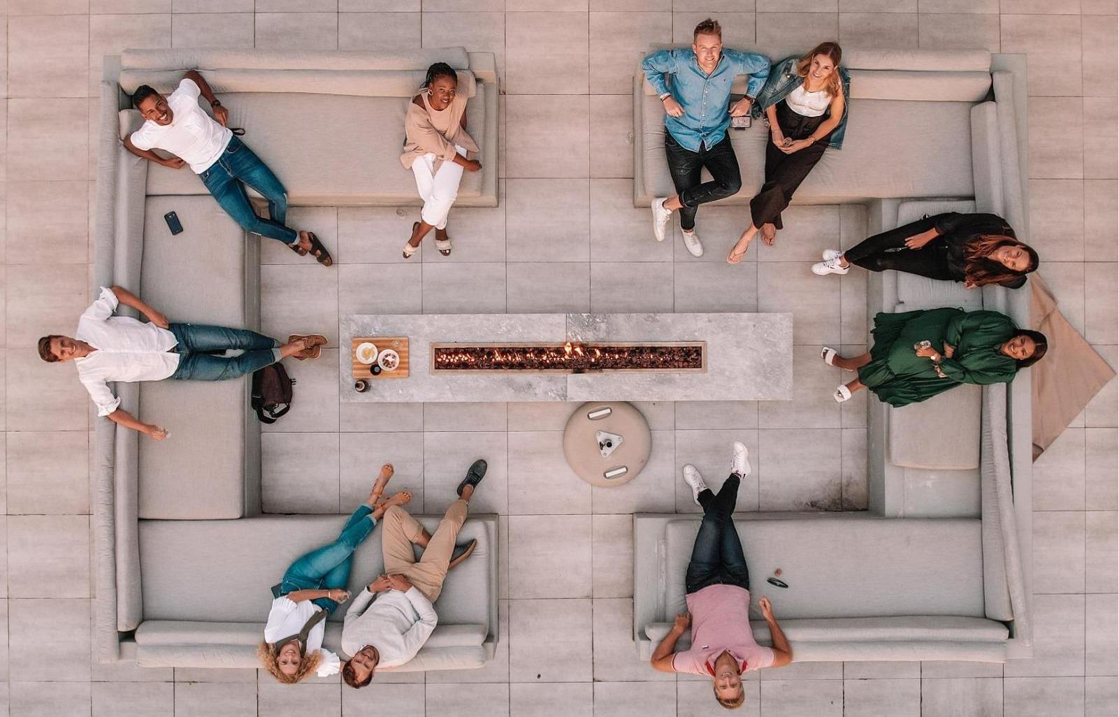 Guests Enjoying the Fire Pit at Atlantic Horizons in Camps Bay by Nox Rentals