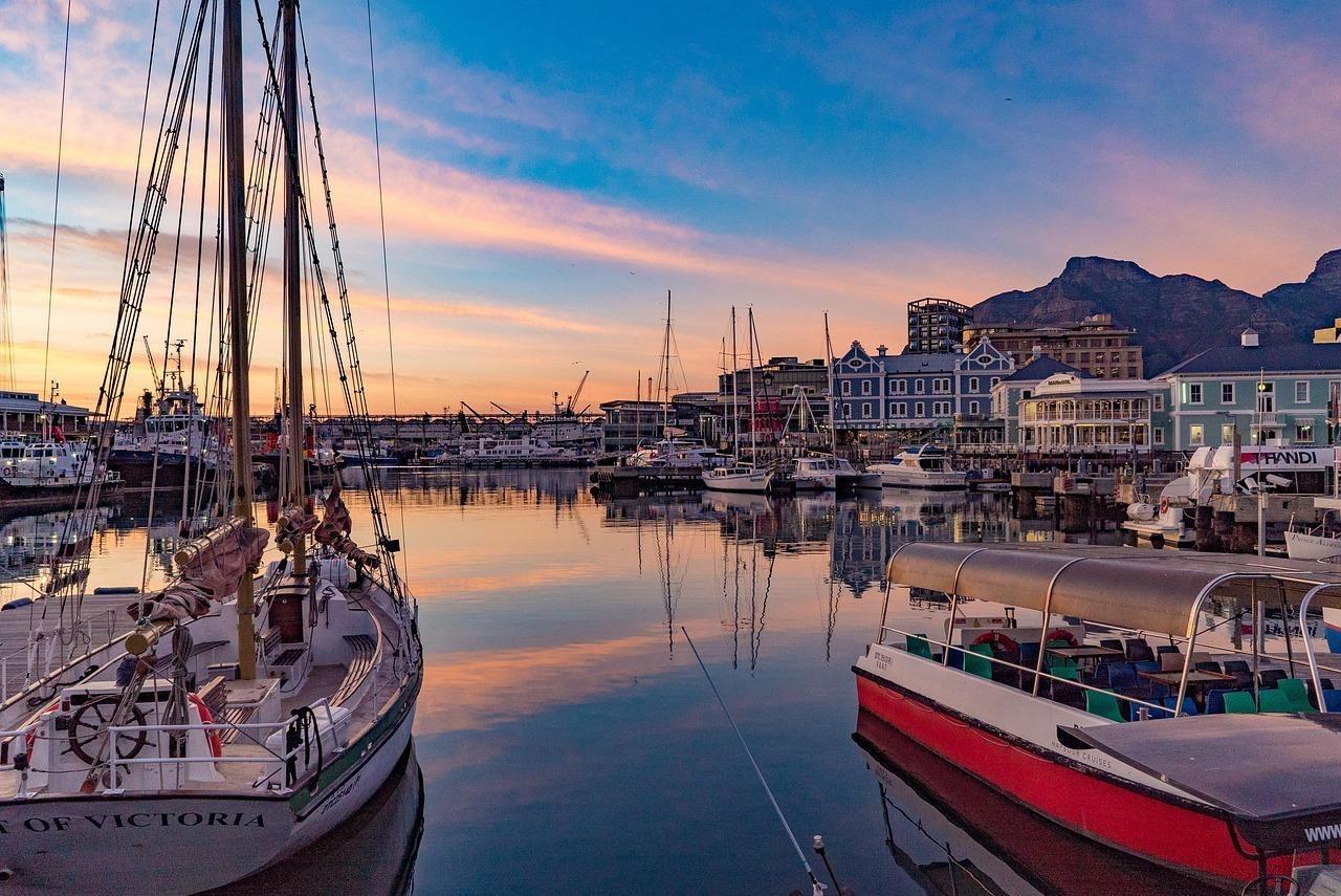 V&A Waterfront Harbour with boats in the water at Sunrise